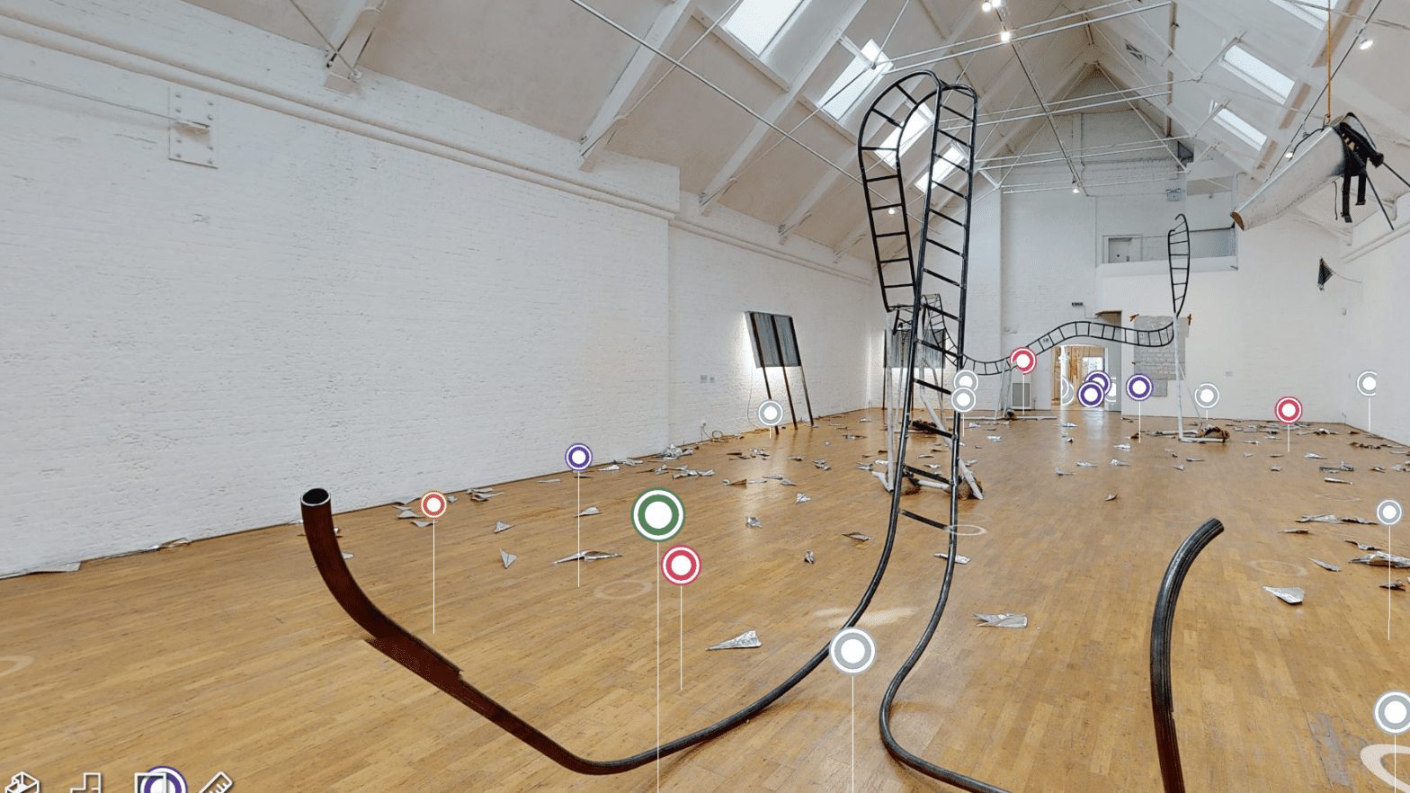 Screenshot of the virtual exhibition of Jesse Darling: No Medals No Ribbons at Modern Art Oxford. A large steel sculpture that looks like a large unbalanced ladder or rollercoaster fills the main gallery. There are coloured tags dotted across the space.