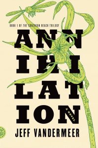 Light yellow book cover with a green dragon fly and a tropical plant with black words reading: Annihilation, Jeff Van Der Meer 