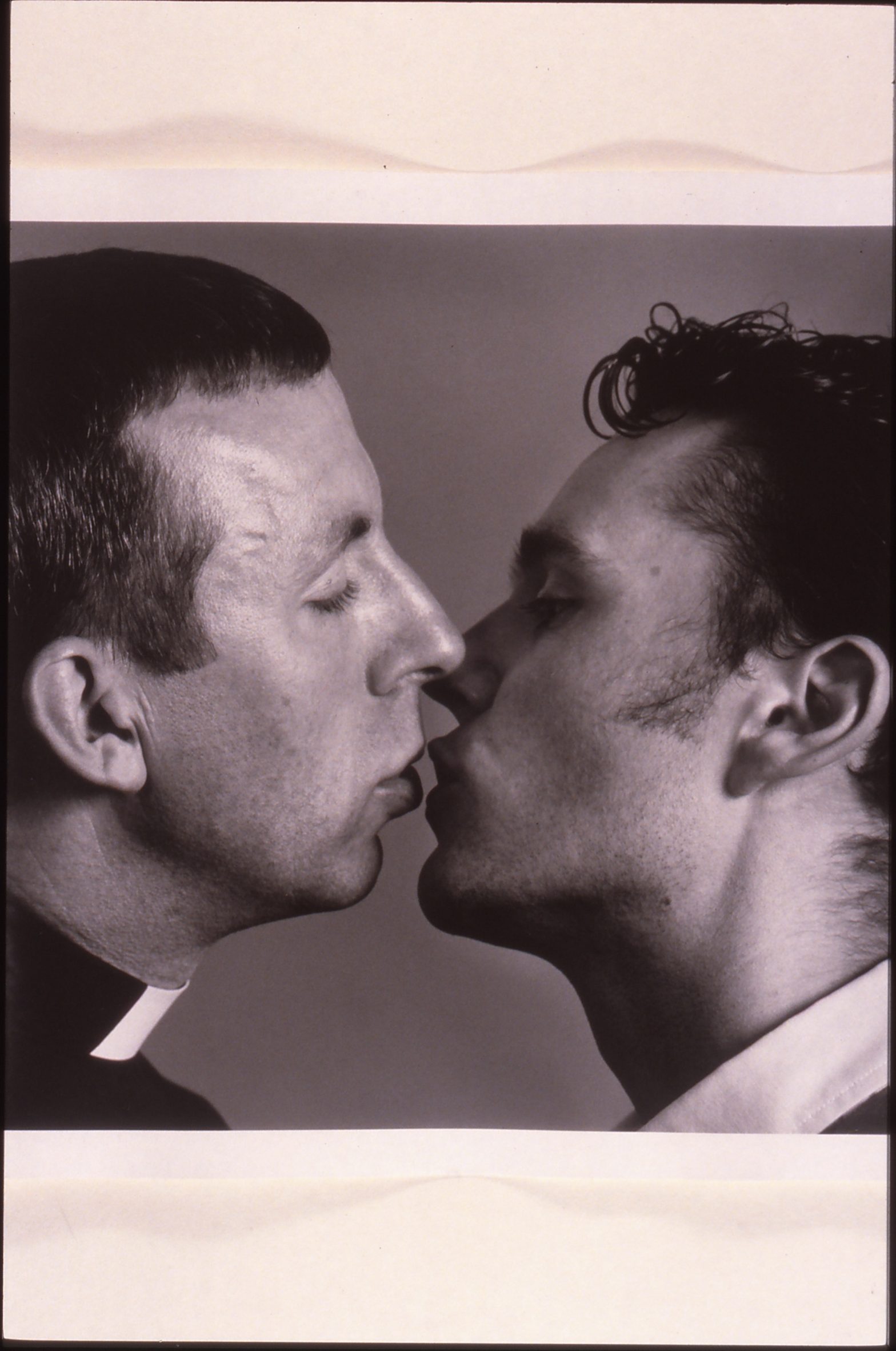 A photo from Modern Art Oxford's 1994 exhibition Positive Lives. It shows to men kissing.